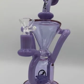 A purple glass coffee maker with a glass handle