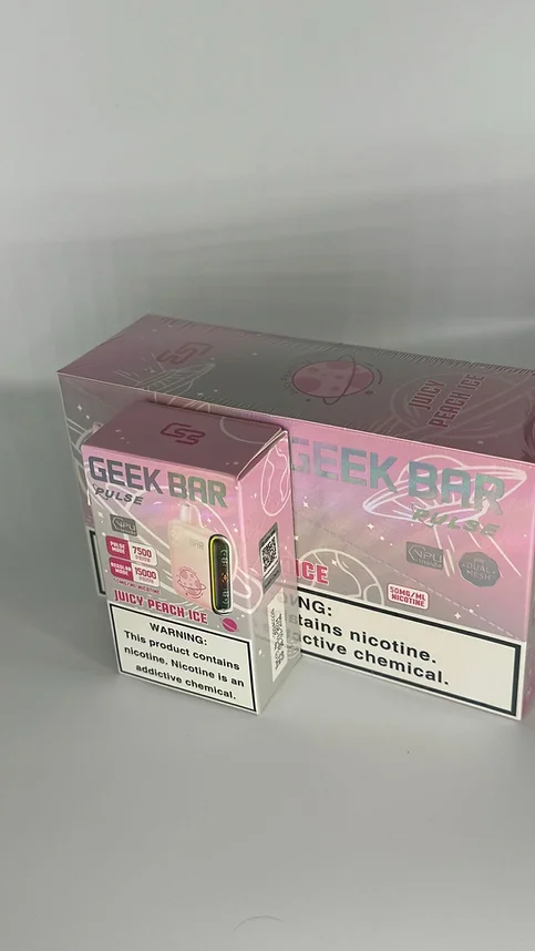 A box of pink cigarettes sitting on top of a table